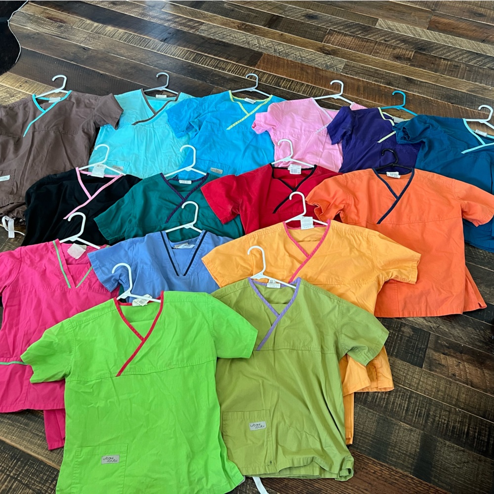 15 Pair of Urbane Scrubs. All in VGUC to EUC. Two tops have a small pen mark.